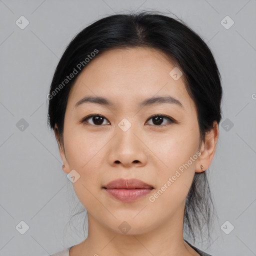 Joyful asian young-adult female with medium  black hair and brown eyes