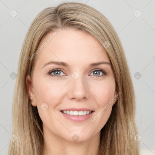 Joyful white young-adult female with long  brown hair and blue eyes