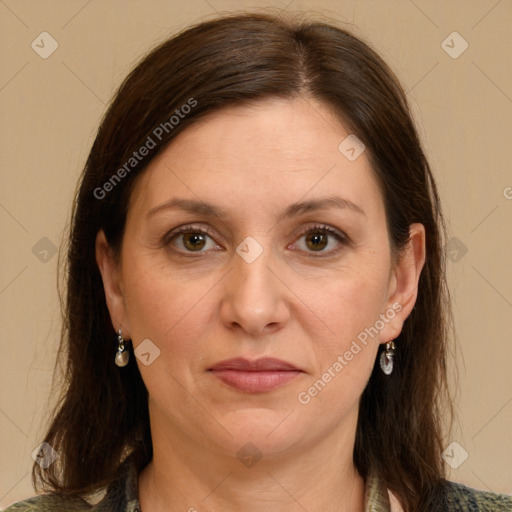 Joyful white adult female with medium  brown hair and grey eyes