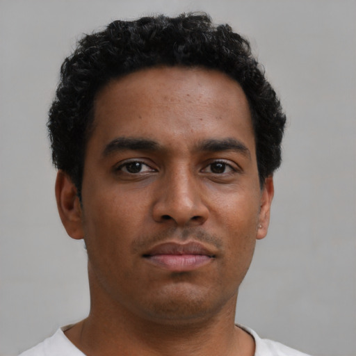Neutral black young-adult male with short  brown hair and brown eyes