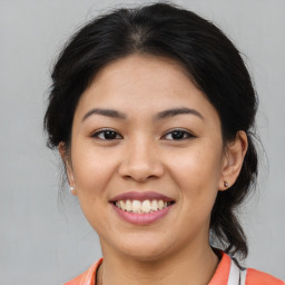 Joyful asian young-adult female with medium  brown hair and brown eyes