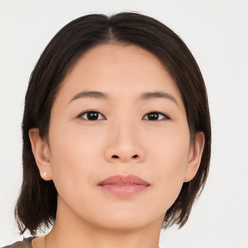 Neutral asian young-adult female with medium  brown hair and brown eyes