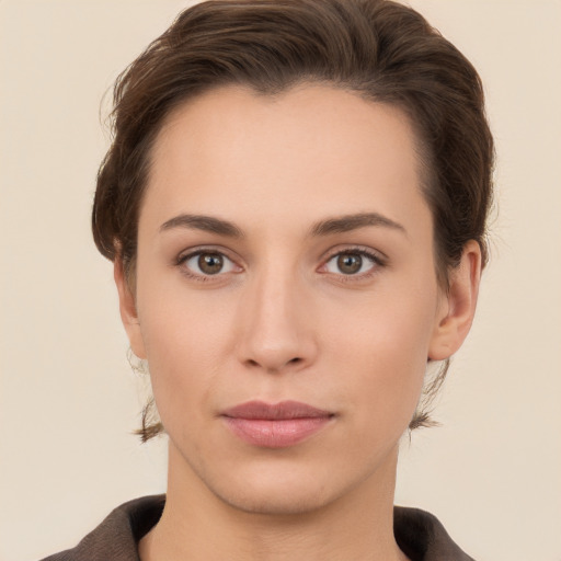 Neutral white young-adult female with short  brown hair and brown eyes