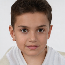 Joyful white child male with short  brown hair and brown eyes