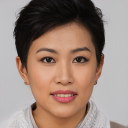 Joyful asian young-adult female with short  brown hair and brown eyes