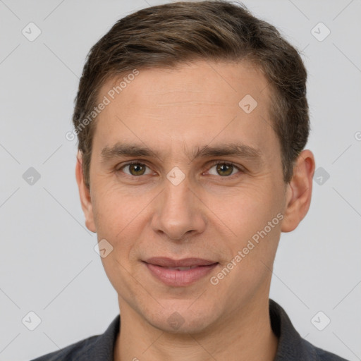 Joyful white adult male with short  brown hair and brown eyes