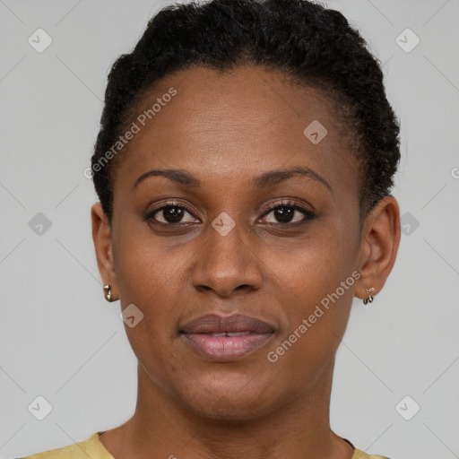 Joyful black young-adult female with short  brown hair and brown eyes