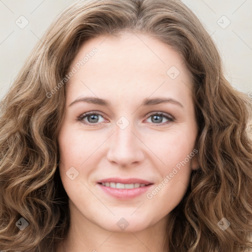 Joyful white young-adult female with long  brown hair and green eyes