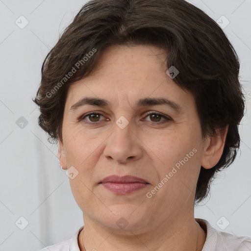 Joyful white adult female with short  brown hair and brown eyes