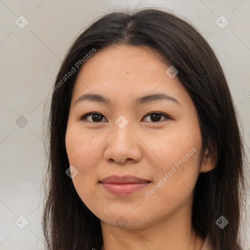 Joyful asian young-adult female with long  brown hair and brown eyes