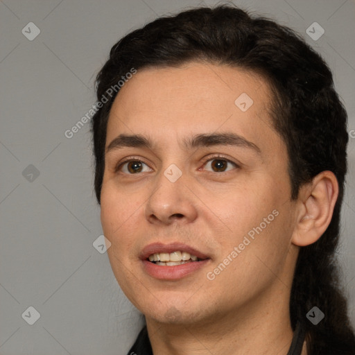 Joyful white young-adult male with short  black hair and brown eyes