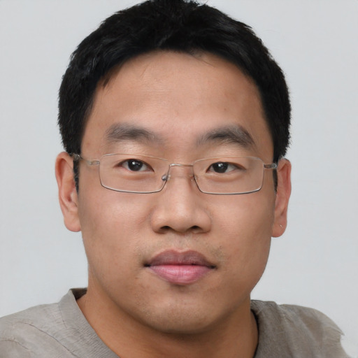 Neutral asian young-adult male with short  brown hair and brown eyes