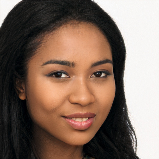 Joyful latino young-adult female with long  brown hair and brown eyes