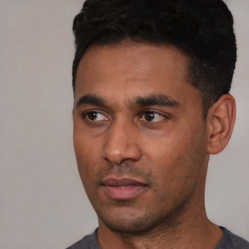 Neutral latino young-adult male with short  black hair and brown eyes