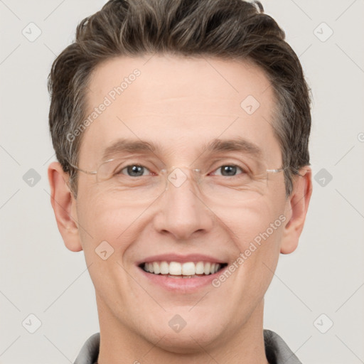 Joyful white adult male with short  brown hair and grey eyes