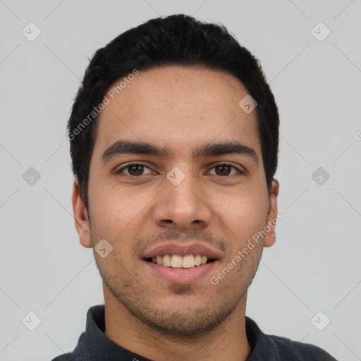 Joyful latino young-adult male with short  black hair and brown eyes
