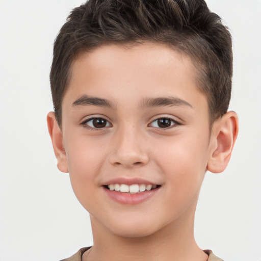 Joyful white child male with short  brown hair and brown eyes