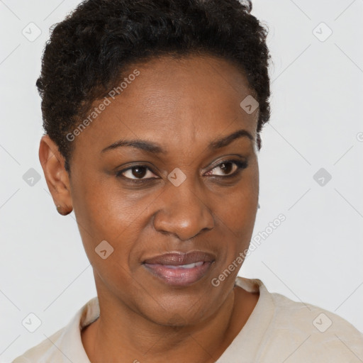 Joyful black adult female with short  brown hair and brown eyes