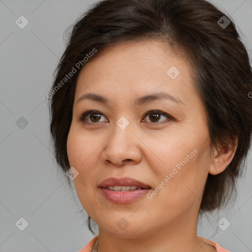 Joyful white adult female with medium  brown hair and brown eyes