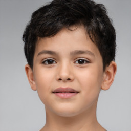 Joyful white child male with short  brown hair and brown eyes