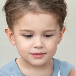 Joyful white child male with short  brown hair and brown eyes