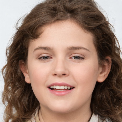 Joyful white child female with medium  brown hair and brown eyes