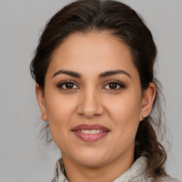 Joyful white young-adult female with medium  brown hair and brown eyes