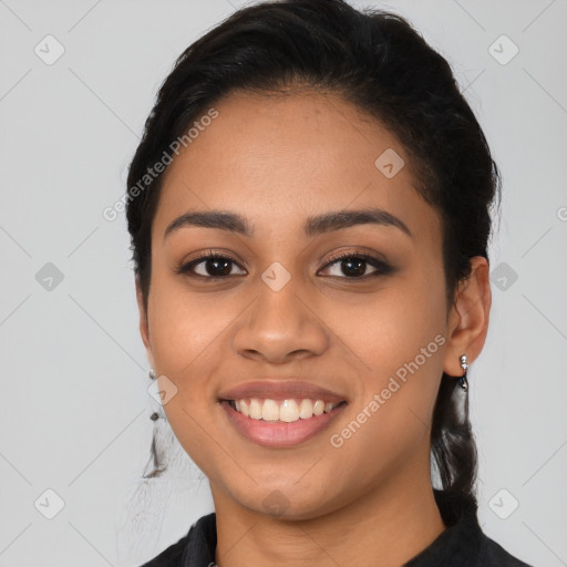 Joyful latino young-adult female with long  black hair and brown eyes