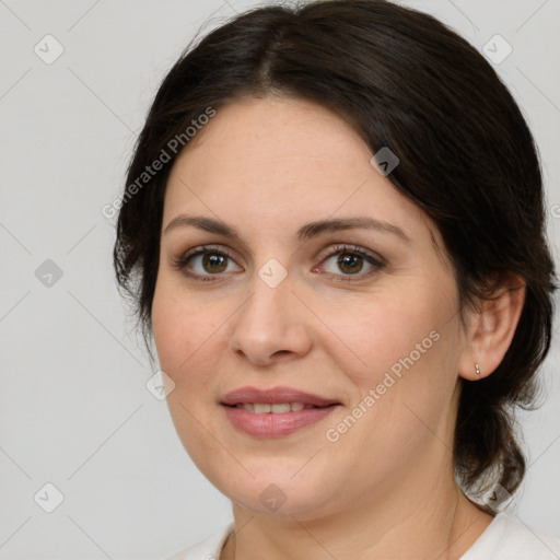 Joyful white adult female with medium  brown hair and brown eyes