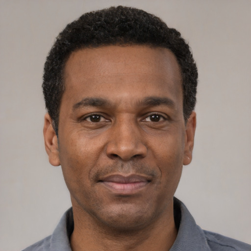 Neutral latino adult male with short  black hair and brown eyes