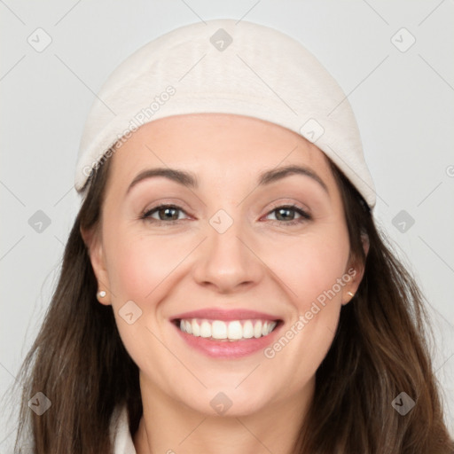 Joyful white young-adult female with long  brown hair and grey eyes