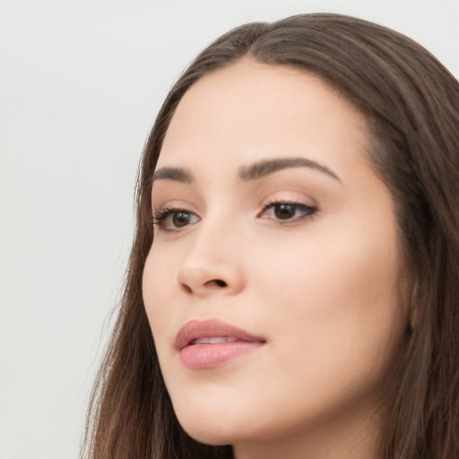 Neutral white young-adult female with long  brown hair and brown eyes