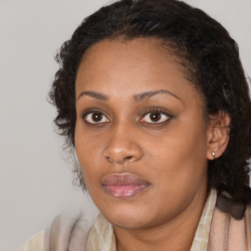 Neutral black young-adult female with medium  brown hair and brown eyes