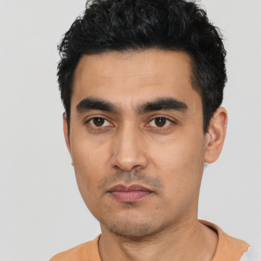 Neutral latino young-adult male with short  black hair and brown eyes