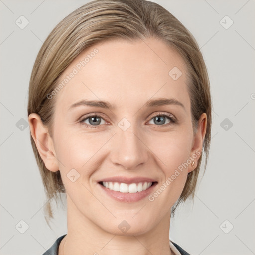 Joyful white young-adult female with medium  brown hair and blue eyes