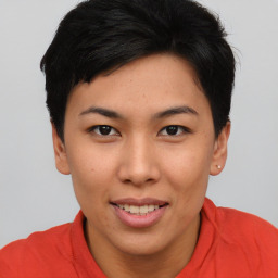 Joyful asian young-adult female with short  brown hair and brown eyes