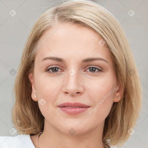 Joyful white young-adult female with medium  brown hair and blue eyes