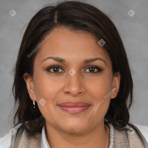 Joyful latino adult female with medium  brown hair and brown eyes