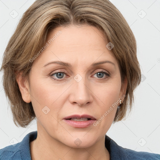 Joyful white adult female with medium  brown hair and grey eyes