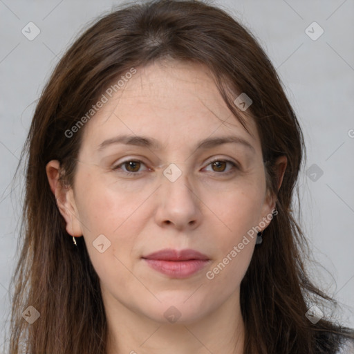 Joyful white adult female with long  brown hair and grey eyes