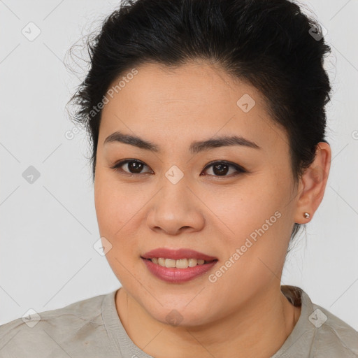 Joyful asian young-adult female with short  brown hair and brown eyes