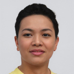 Joyful asian young-adult female with short  black hair and brown eyes