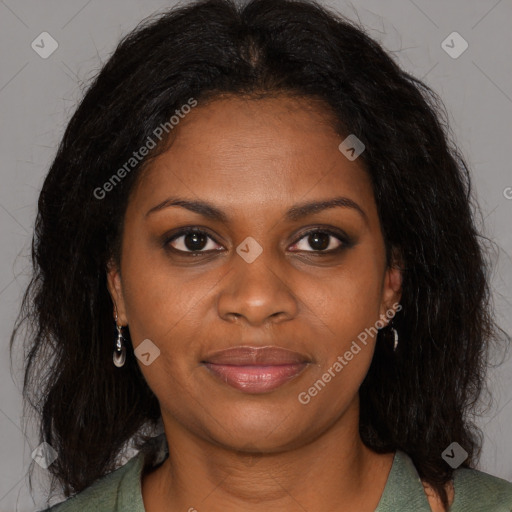 Joyful black young-adult female with long  brown hair and brown eyes