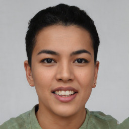 Joyful asian young-adult female with short  brown hair and brown eyes