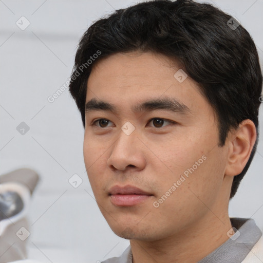 Neutral white young-adult male with short  black hair and brown eyes