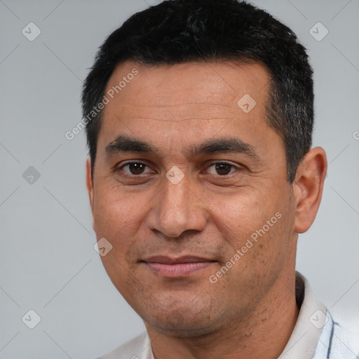 Joyful white adult male with short  black hair and brown eyes