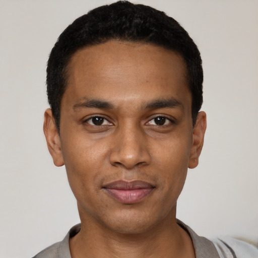Neutral black young-adult male with short  black hair and brown eyes