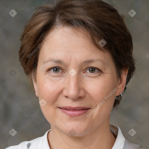 Joyful white adult female with short  brown hair and brown eyes