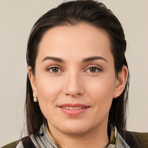 Joyful white young-adult female with medium  brown hair and brown eyes