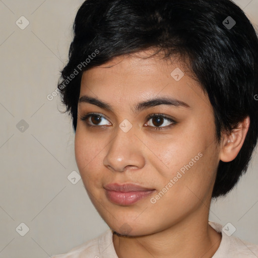 Joyful latino young-adult female with medium  black hair and brown eyes